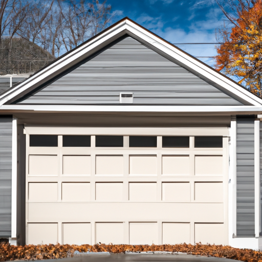 Exterior view of a Hopkinton home garage door with visible bottom seal and threshold in autumn.