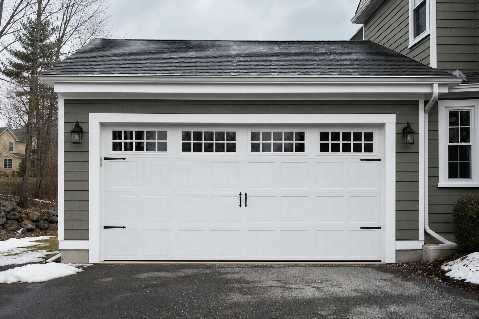 Suburban garage exterior in Hopkinton with a full garage door visible on a cloudy day